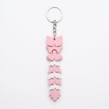 Articulated cat keychain light pink – on bag
