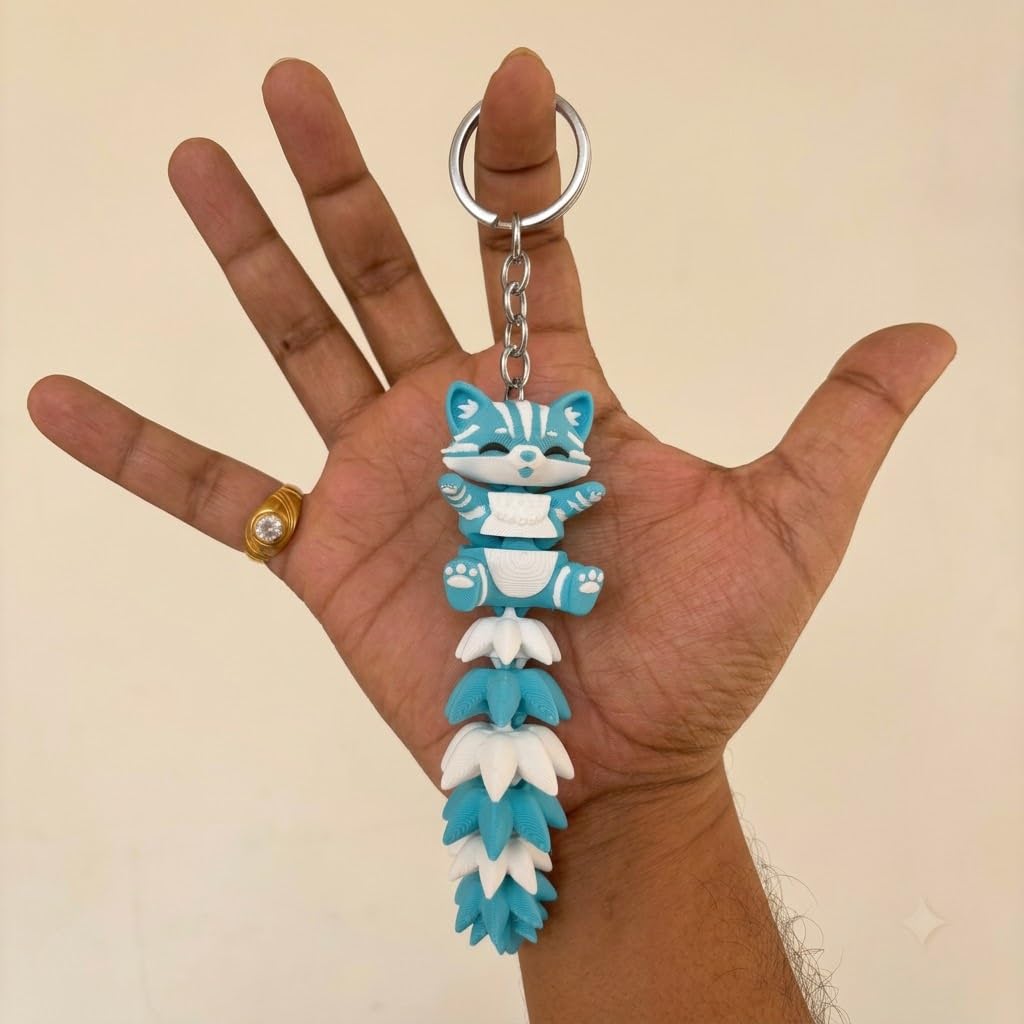 Articulated cat keychain sky blue – on bag