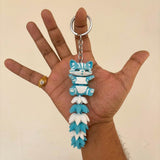 Articulated cat keychain sky blue – on bag