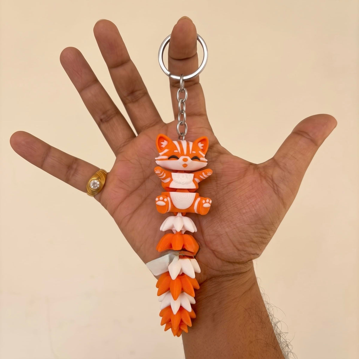 Articulated cat keychain orange – movable tail