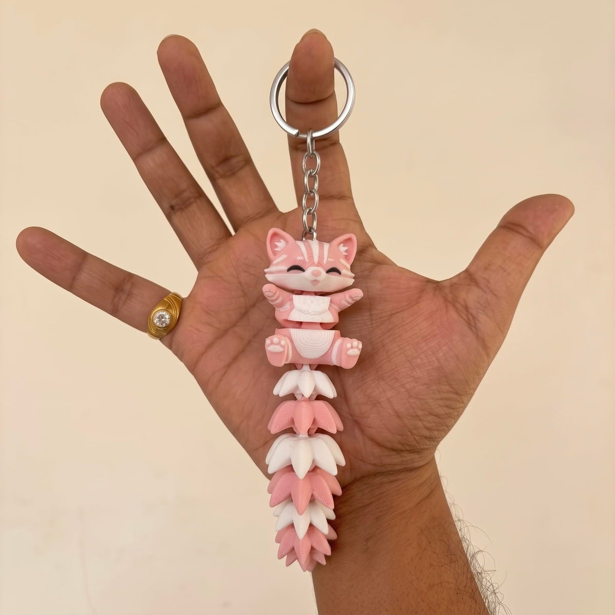 Articulated cat keychain light pink – movable tail