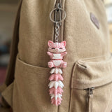 Articulated cat keychain light pink – detail