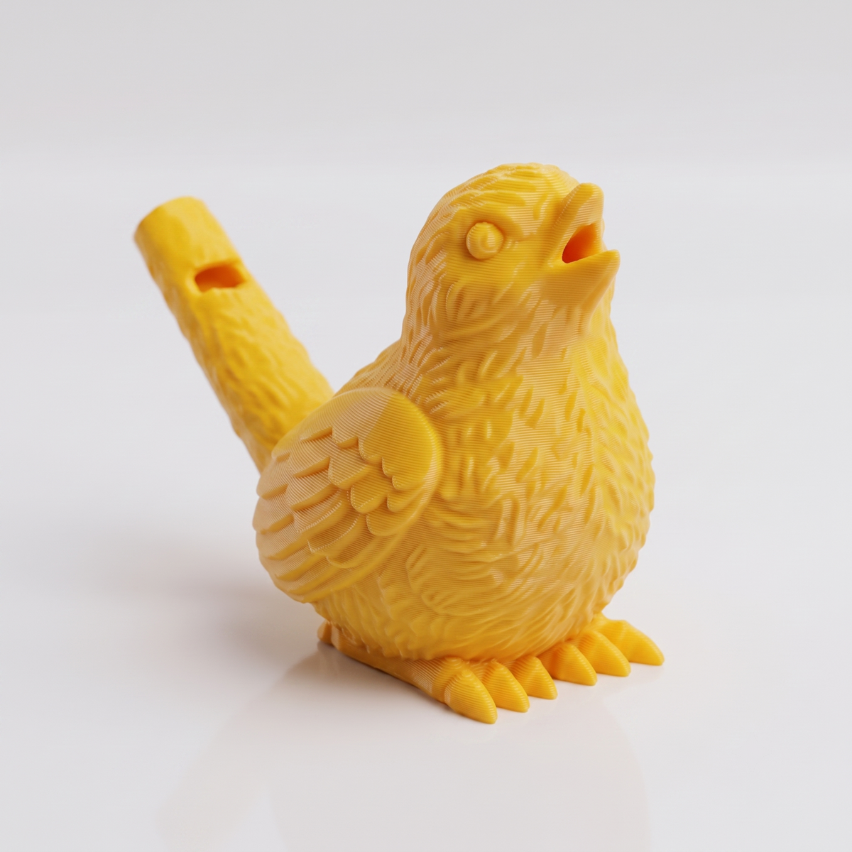 Yellow 3D printed bird water whistle