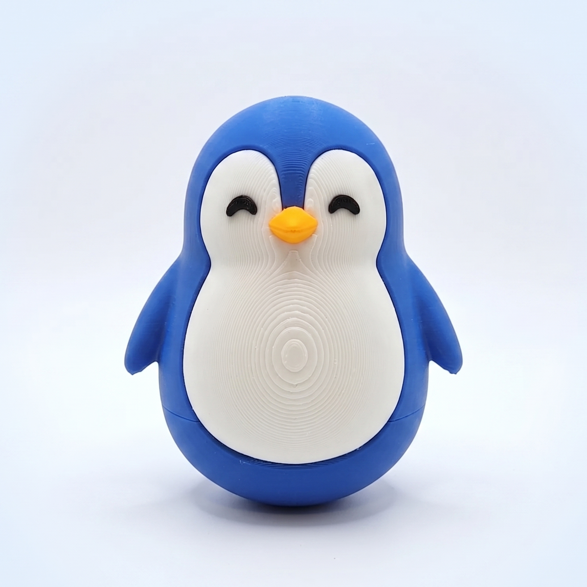 Blue and white chubby penguin figurine, 3D printed desk buddy by Swag Layers
