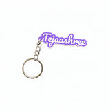 Purple and white 2-colour 3D printed name keychain reading Tejaashree