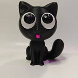 Swag Layers black 3D printed cat glasses holder with large white eyes and a small pink tongue on a white background