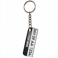 Swag Layers personalized Indian number plate keychain with a built-in emergency safety whistle in black and white.