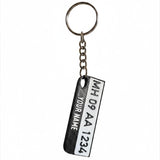 Swag Layers personalized Indian number plate keychain with a built-in emergency safety whistle in black and white.