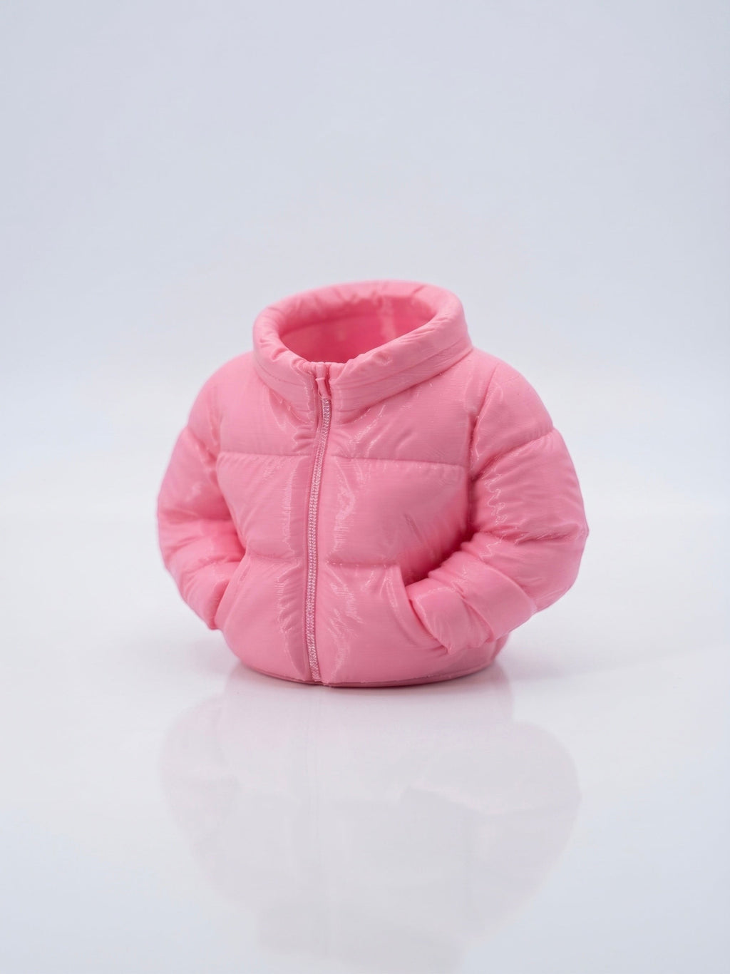 Swag Layers 3D printed puffer jacket desk pen holder in matte pink with realistic quilted texture and zipper detail.