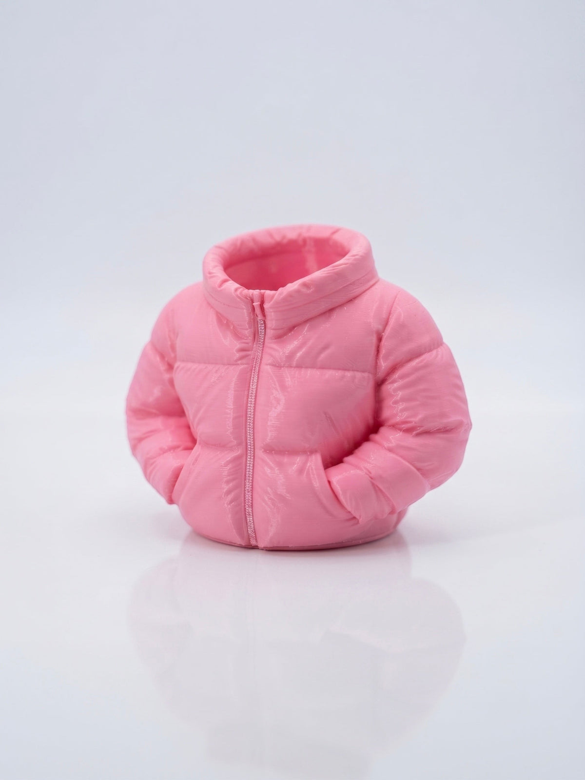 Swag Layers 3D printed puffer jacket desk pen holder in matte pink with realistic quilted texture and zipper detail.