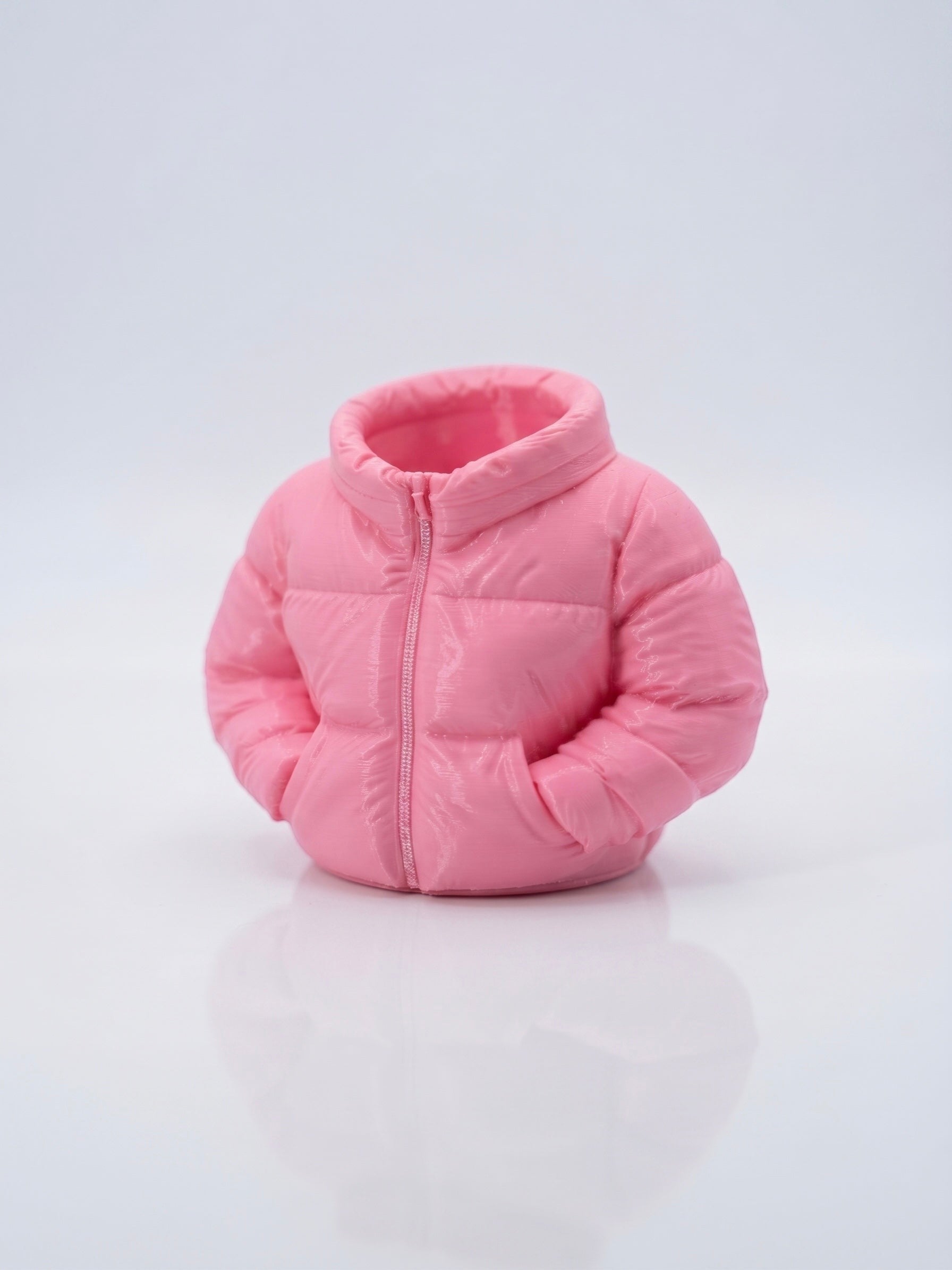 Swag Layers 3D printed puffer jacket desk pen holder in matte pink with realistic quilted texture and zipper detail.